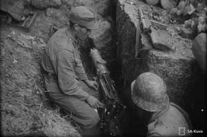 Финские пулеметчики, район Тиенхаары, 25 июня 1944 г. Фотография из архива Сил обороны Финляндии (SA-kuva).